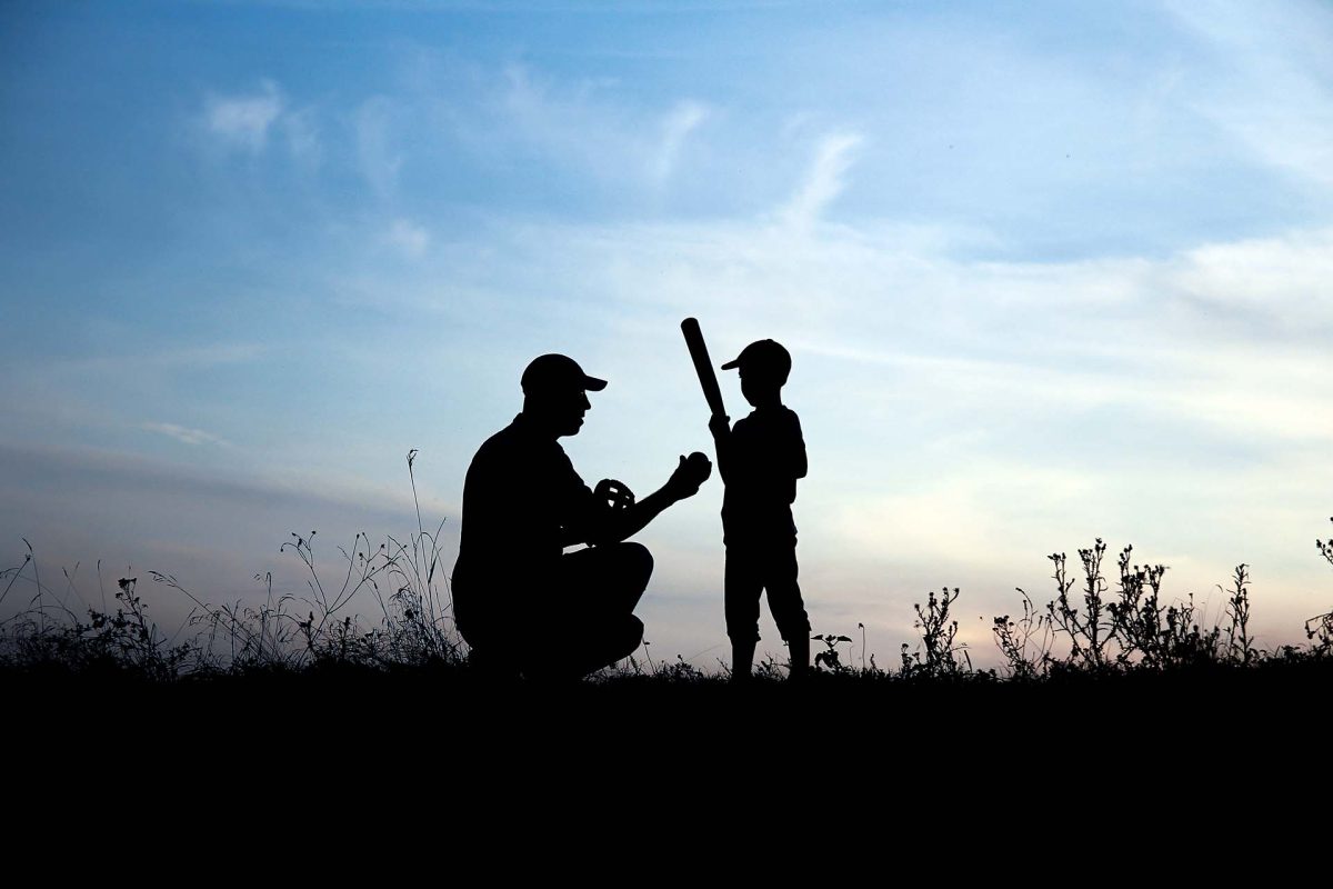 father and son playing baseball
