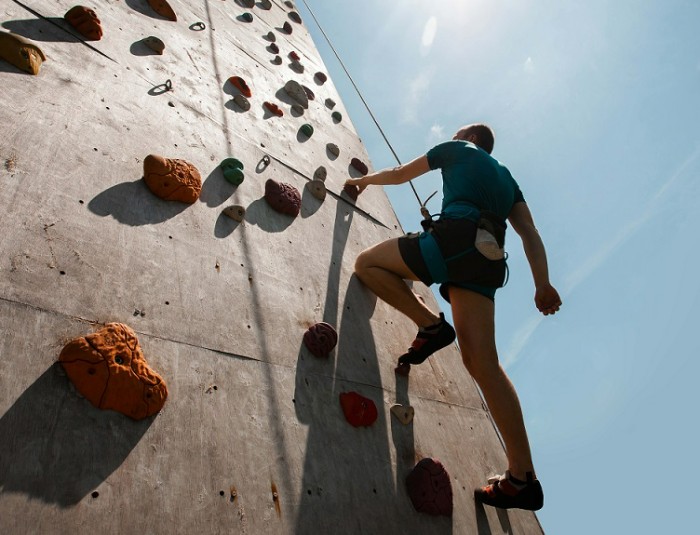 man rock climbing outdoors