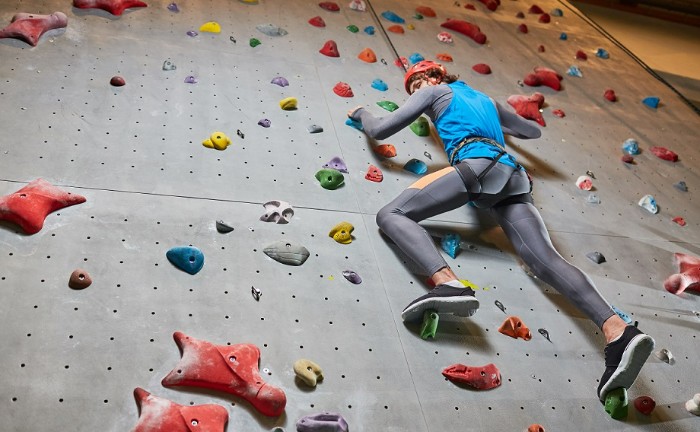woman climbing indoors